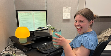 Intern working happily at her desk